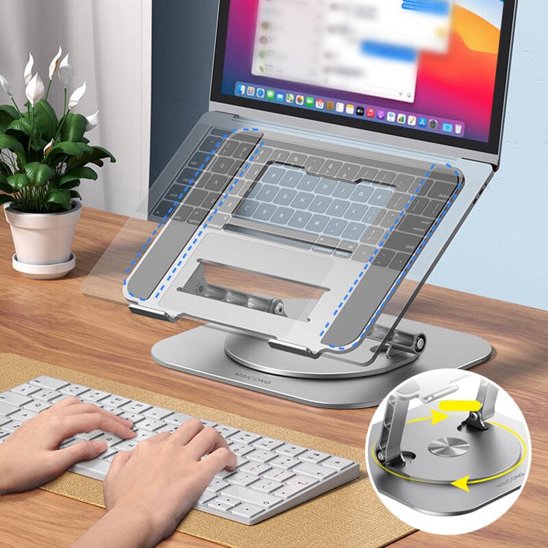 Laptop op 360 graden draaibare standaard naast toetsenbord.